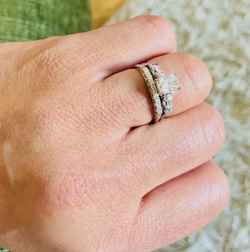 Jewelry work result showing repaired ring with restored stones